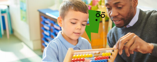 Child and teacher in a classroom holding an abacus.
