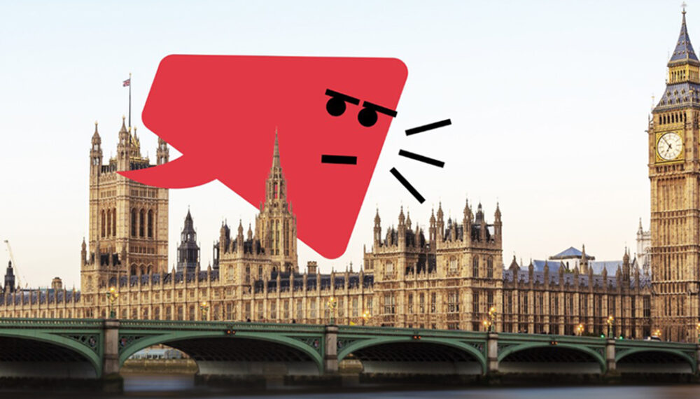 A graphic overlay on a photograph of the Elizabeth Tower, commonly known as Big Ben, and Westminster Bridge over the River Thames in London. The graphic is a red speech bubble with an angry face and three black lines indicating shouting.